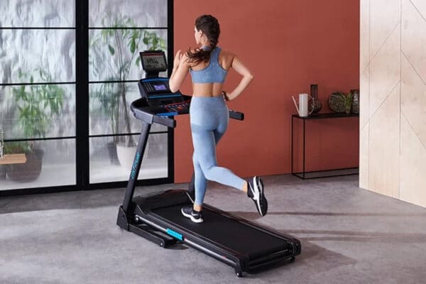 JTX Sprint-3 Electric Treadmill woman running