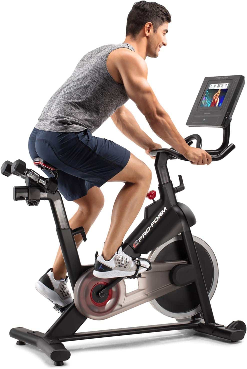 Proform Smart Power 10.0 Exercise Bike - with a male model cycling 