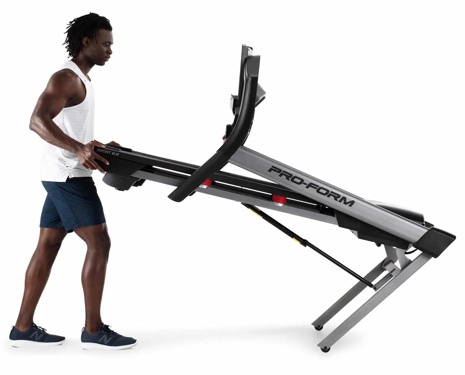 Proform Sport 6.0 folding treadmill - with a male model folding up the machine