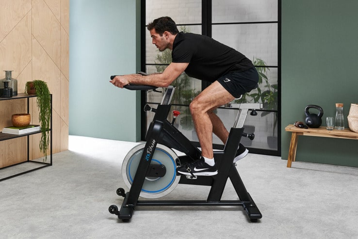 JTX Cyclo 6 Exercise Bike - with a male model exercising