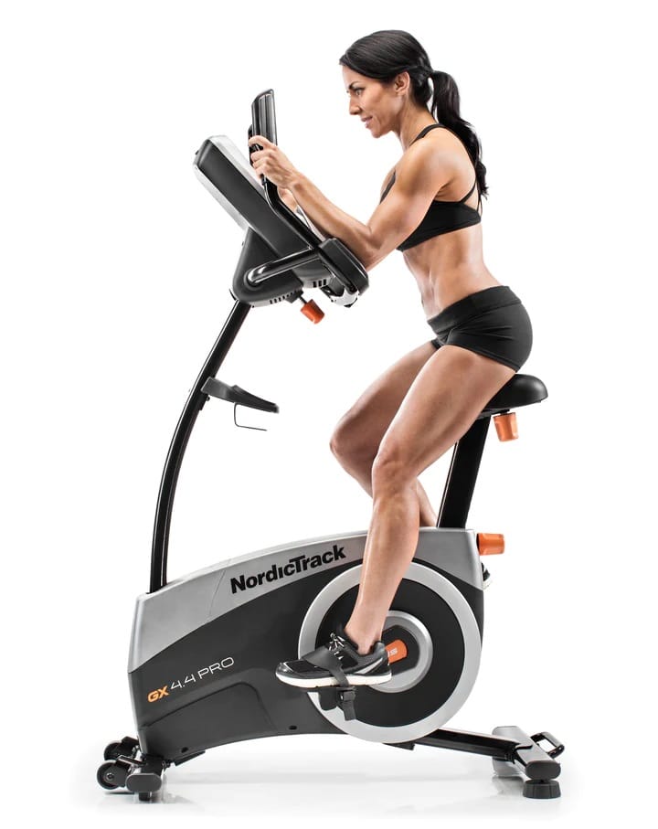 NordicTrack GX 4.4 Pro Exercise Bike - with a female model exercising