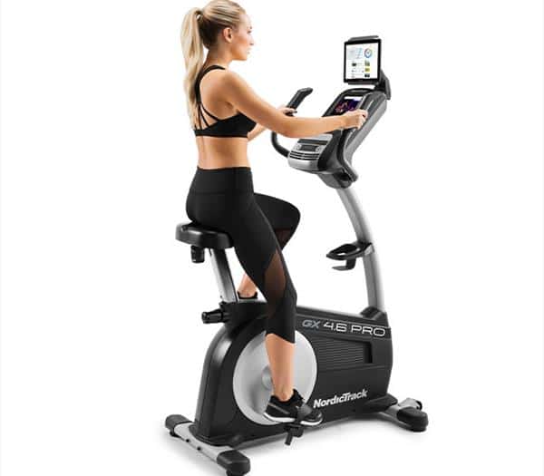 Introduction to the NordicTrack GX 4.6 Pro Exercise Bike From The Classic Series Range - with a female model exercising 