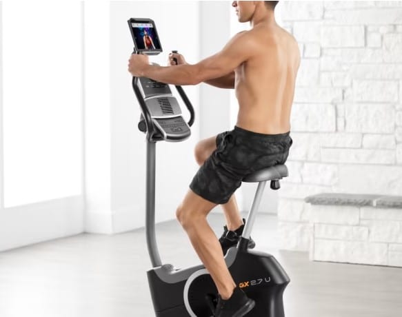 Nordictrack GX 2.7 U Exercise Bike - with a male model cycling