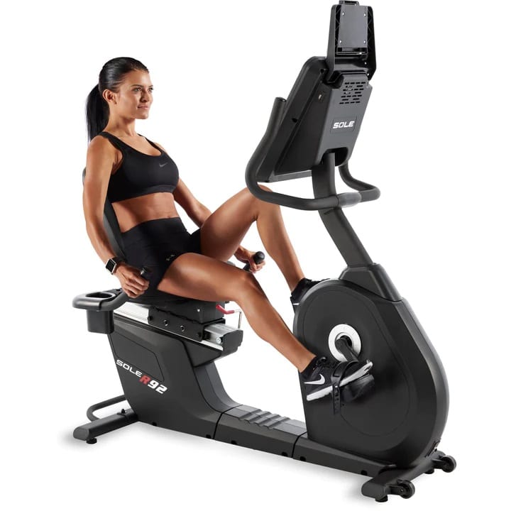 Sole R92 Recumbent Exercise Bike - with a female model