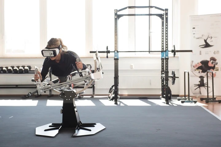ICAROS Pro Commercial Virtual Reality Fitness Equipment - with a female model working out