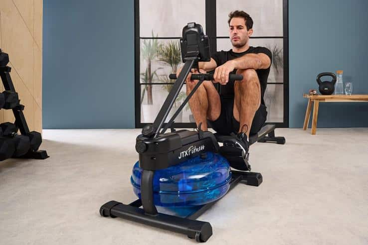 JTX Flow Water Rowing Machine - with a male model exercising 