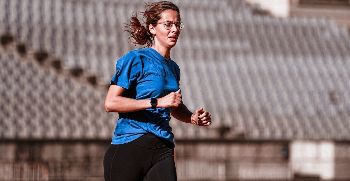 Woman Running on a Running Track