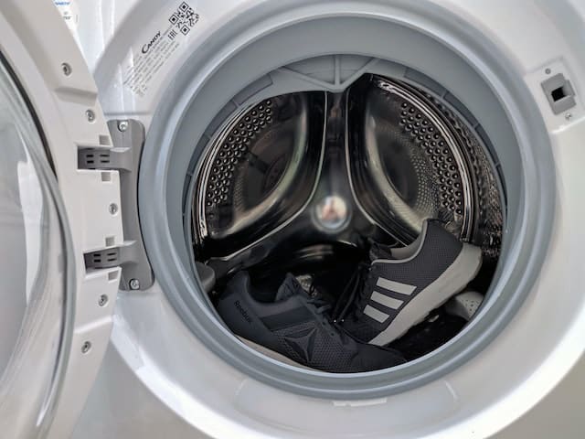 A pair of shoes inside a washing machine