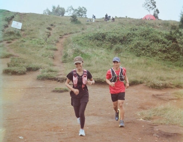 A Couple Jogging Downhill