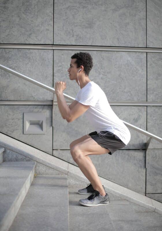 sportsman exercising on stairs
