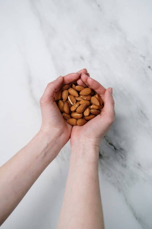 holding almonds nuts 