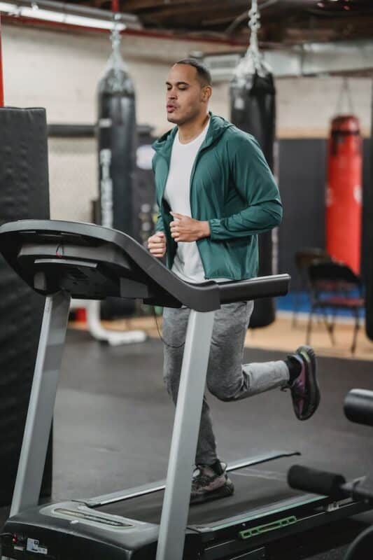 man running on treadmill in the gym