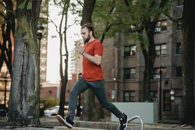 sportsman running on urban stairs during training
